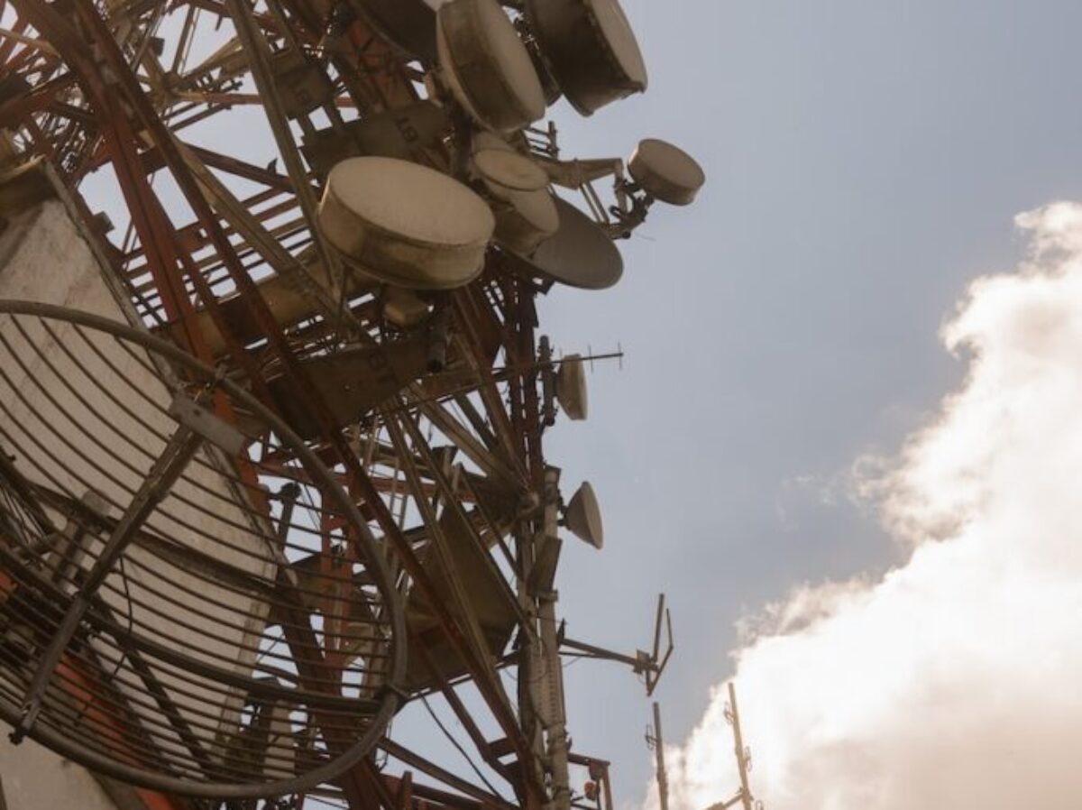 white and red ferris wheel under cloudy sky during daytime