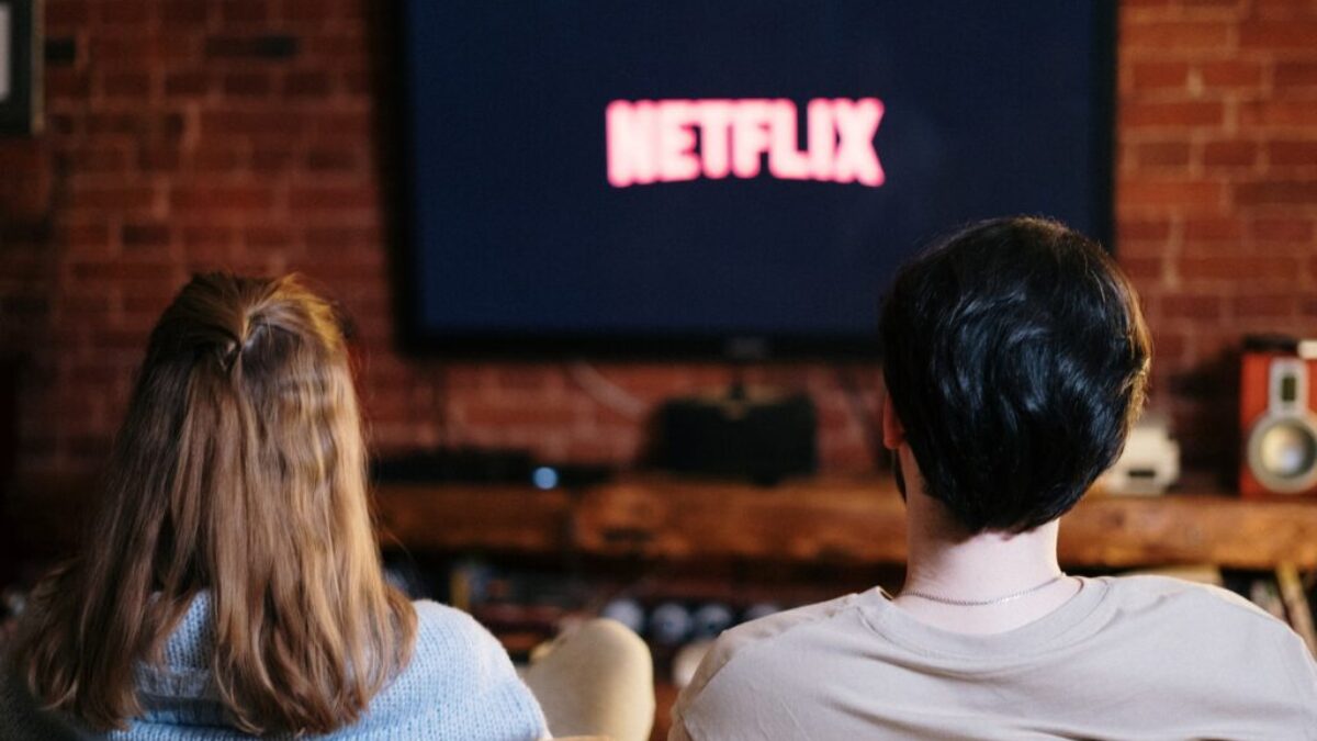 People Sitting on a Couch Watching