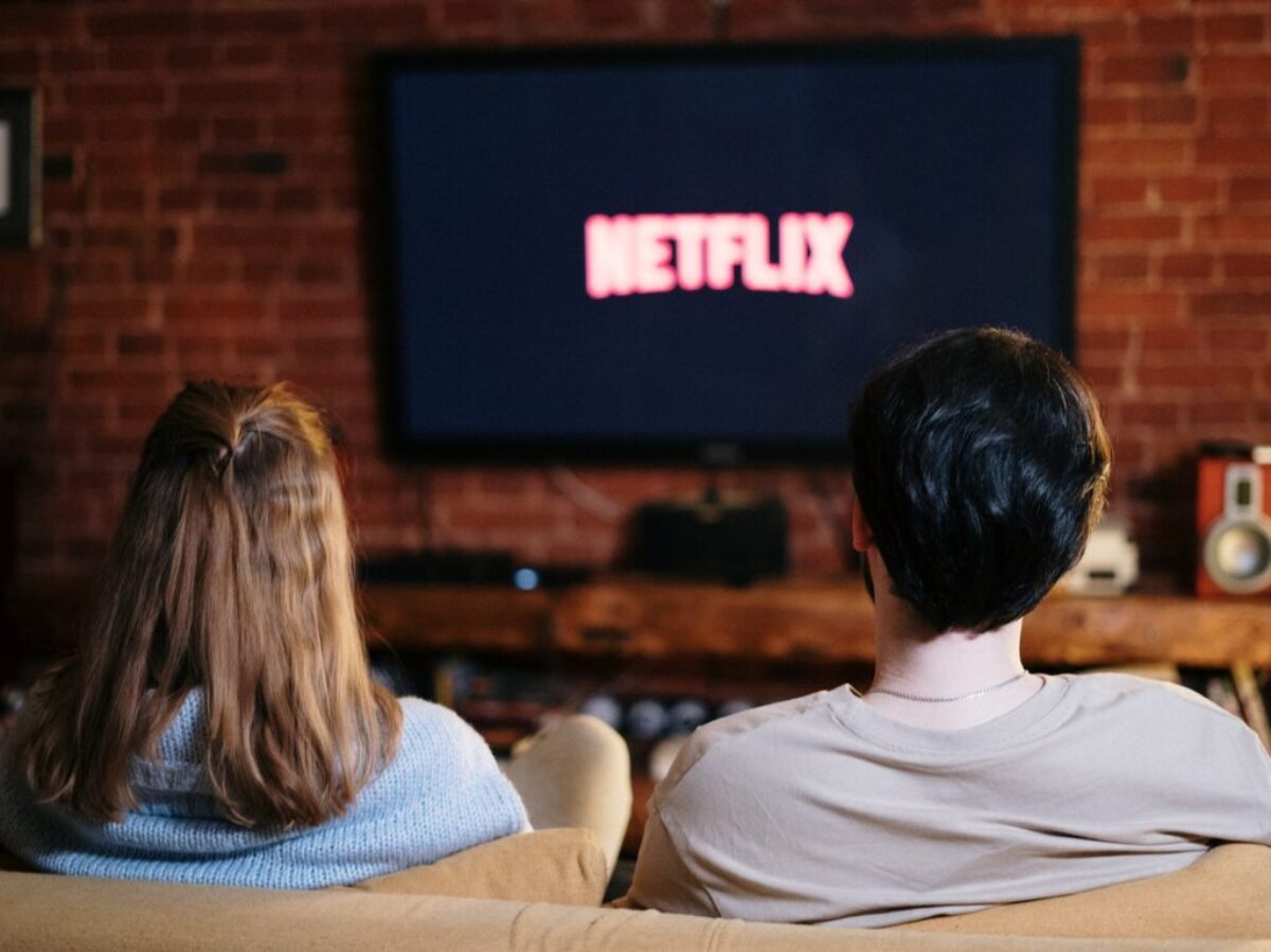 People Sitting on a Couch Watching