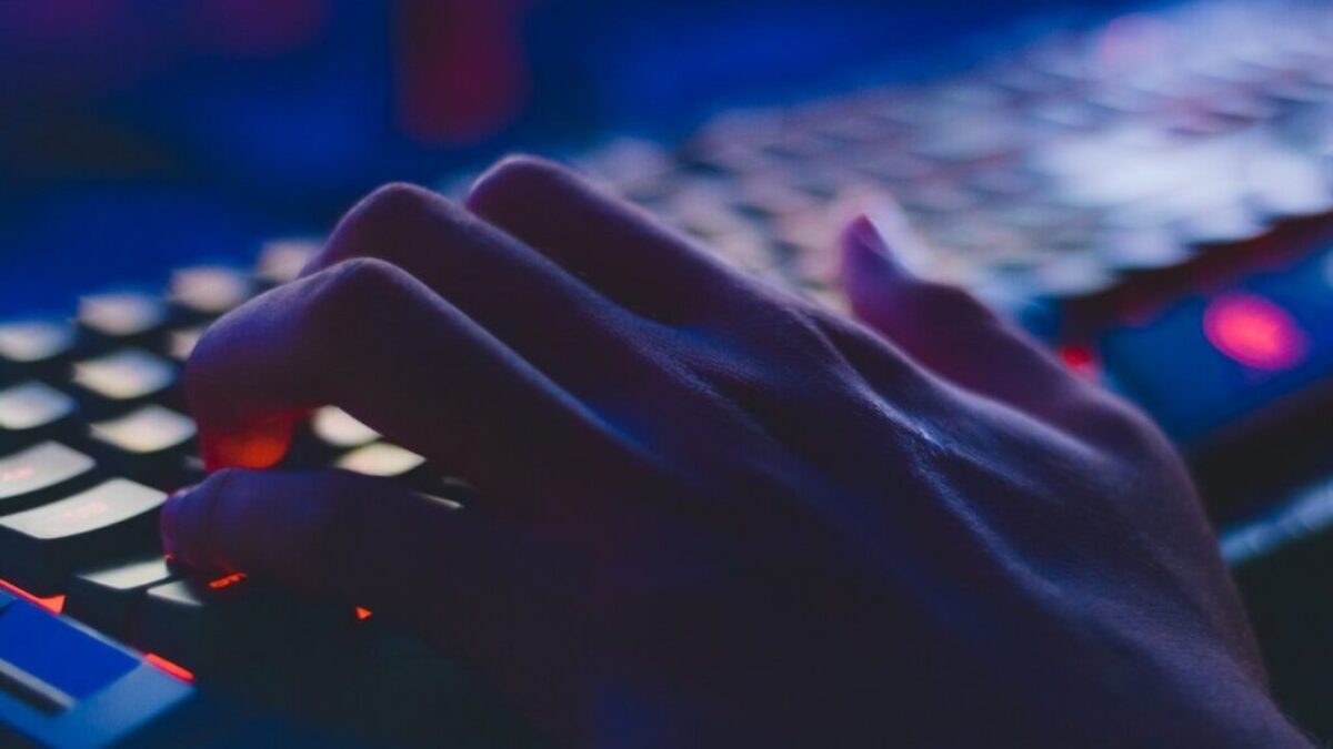 Photo of Person Typing on Computer Keyboard