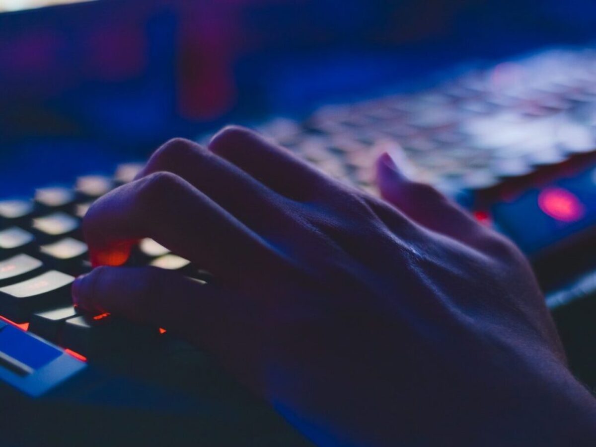 Photo of Person Typing on Computer Keyboard