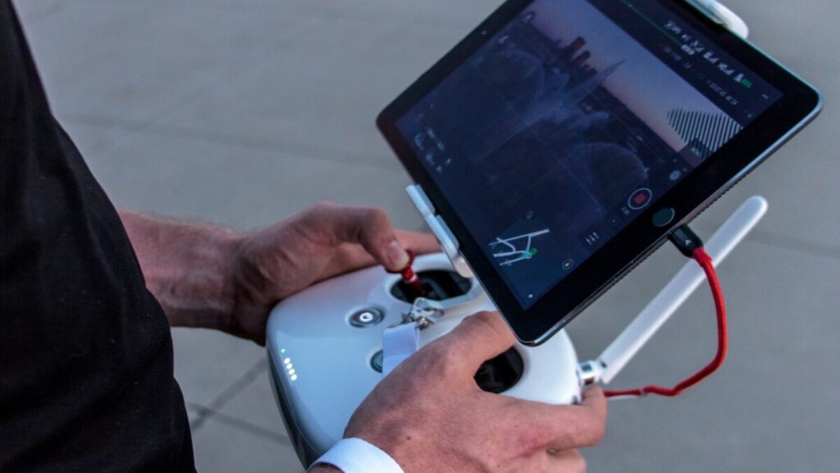 person holding quadcopter controller