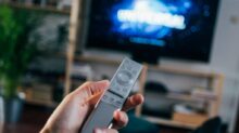 person holding gray remote control