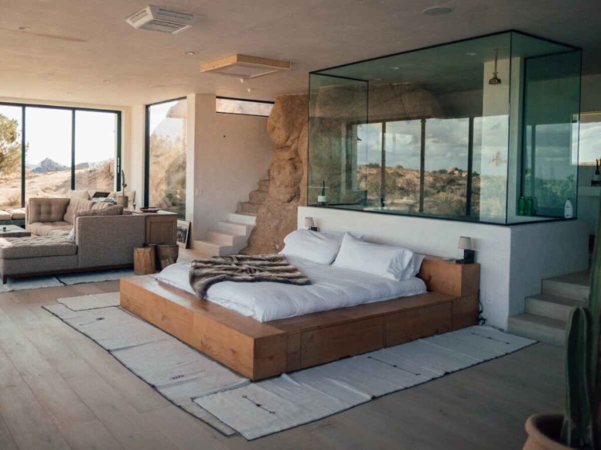 white mattress beside sectional sofa