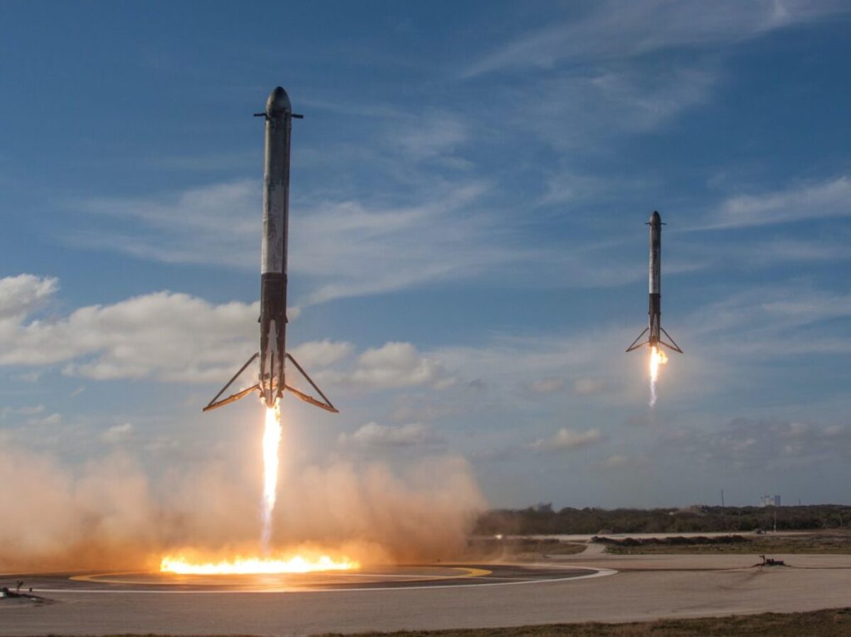 twom white flying rockets during daytime