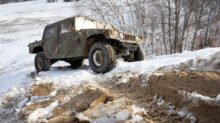 black and white jeep wrangler on snow covered ground during daytime