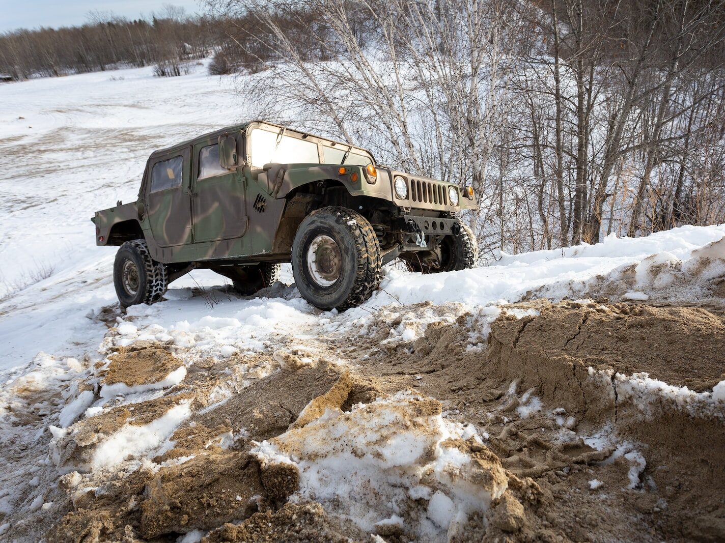 black and white jeep wrangler on snow covered ground during daytime