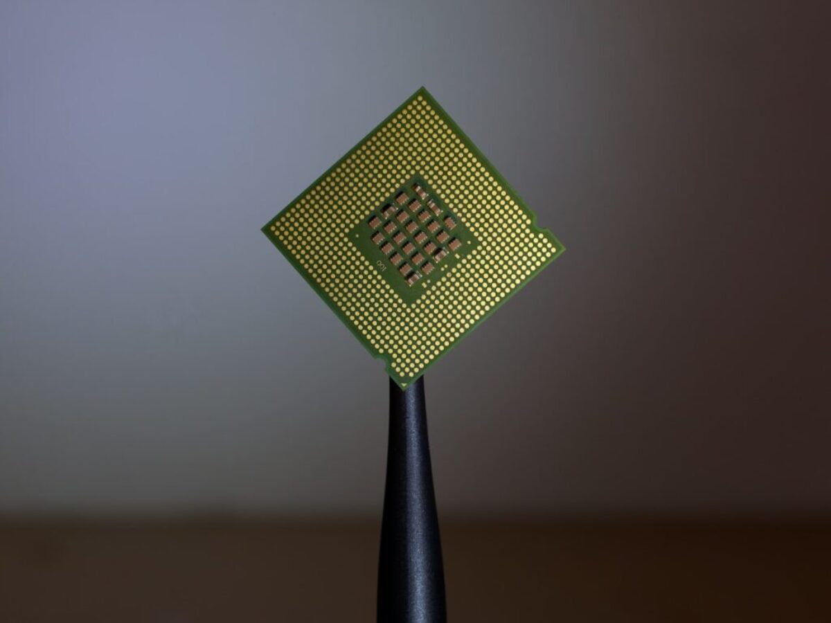 person holding computer cell processor
