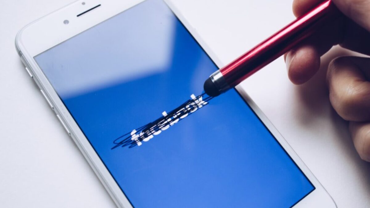 person using silver iPhone 6