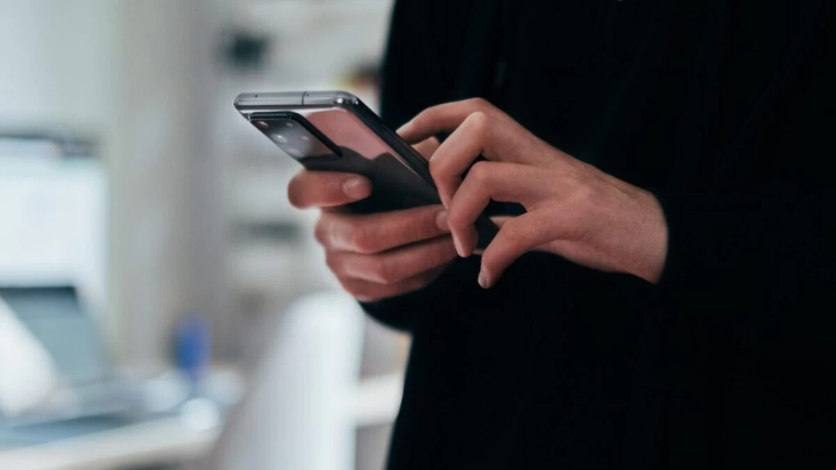 person holding black android smartphone
