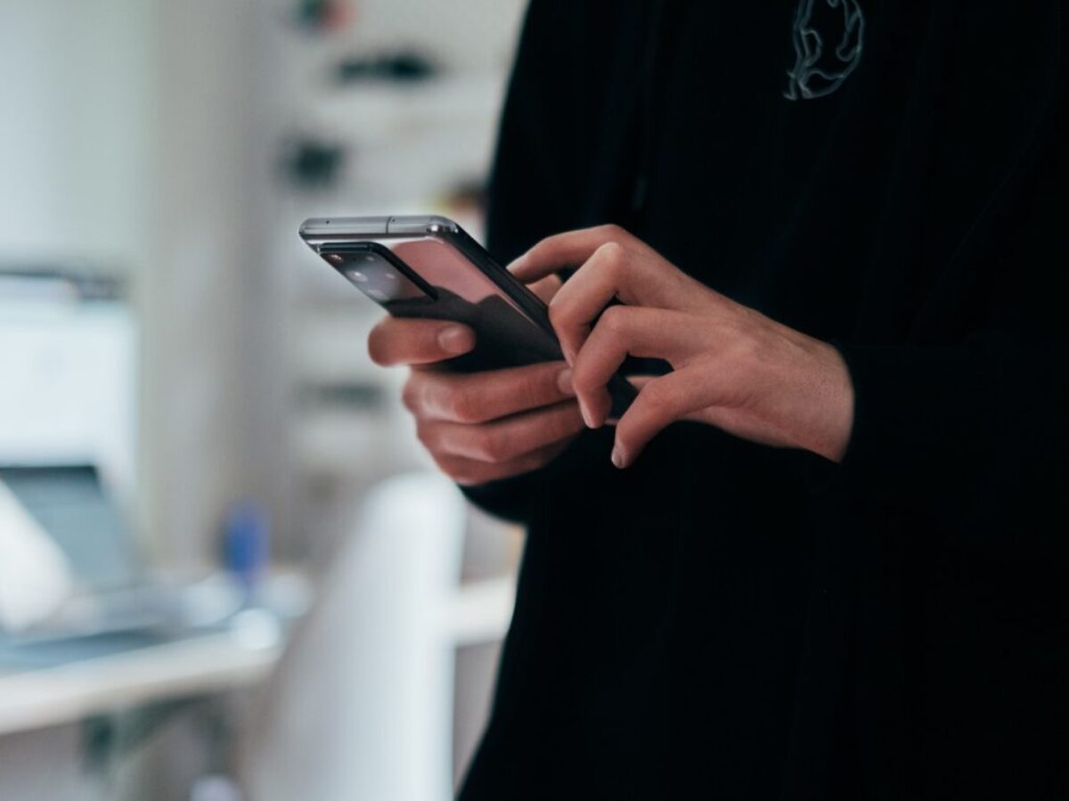 person holding black android smartphone
