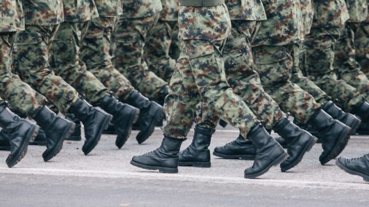 men in green and brown camouflage uniform