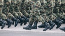 men in green and brown camouflage uniform