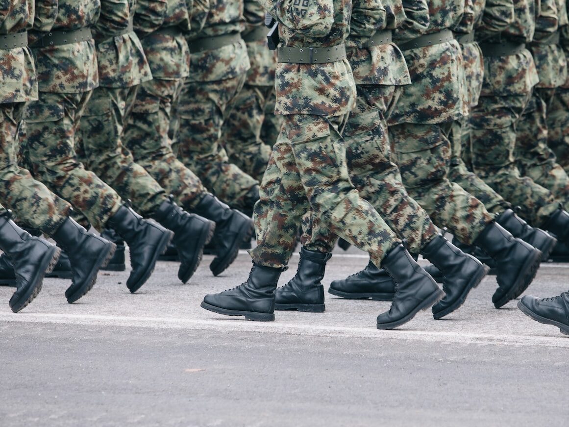men in green and brown camouflage uniform