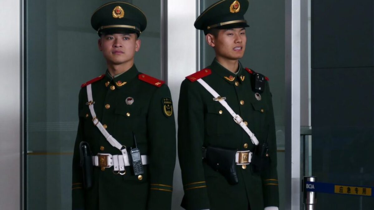 man in black and brown camouflage uniform