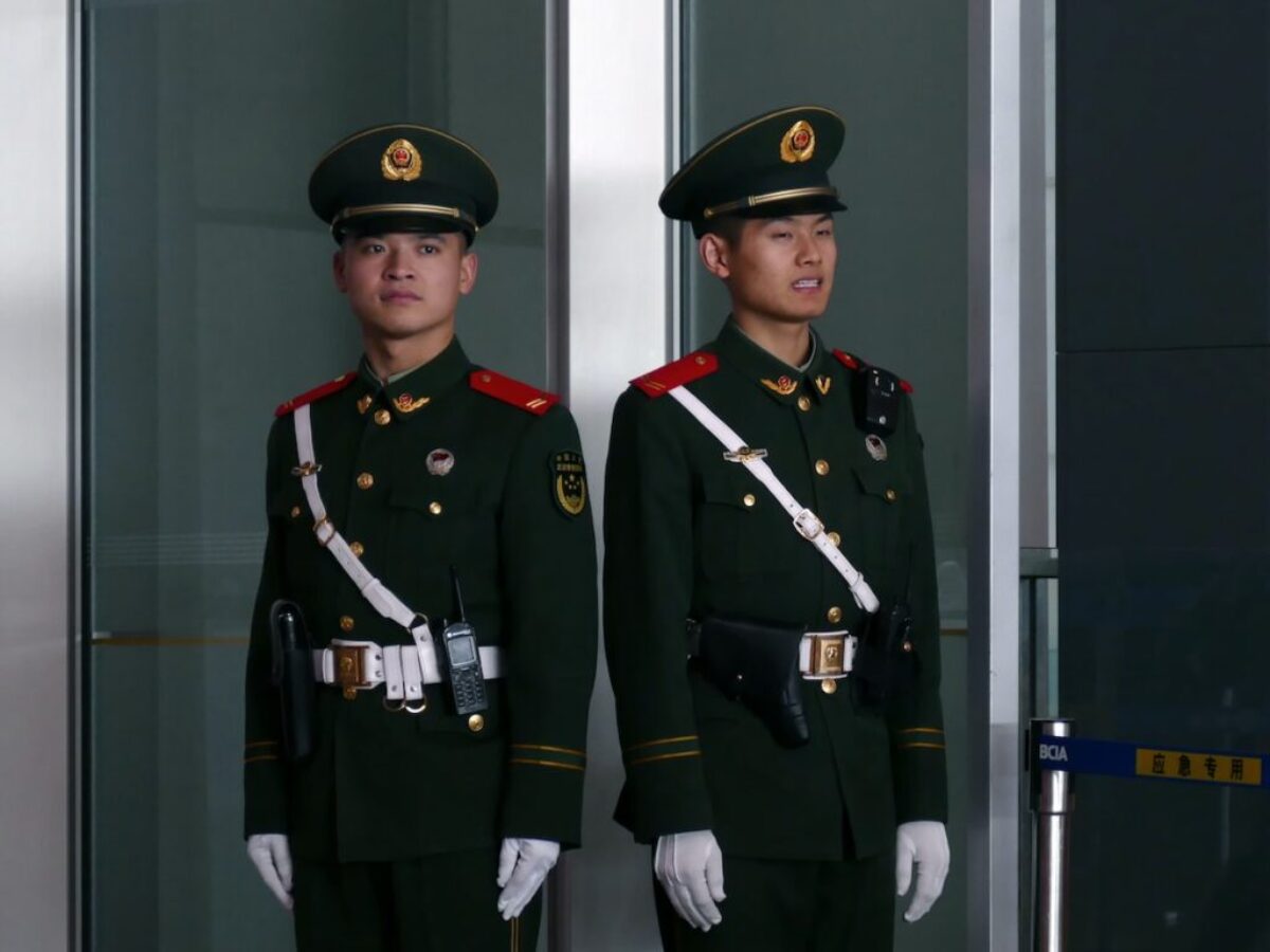 man in black and brown camouflage uniform
