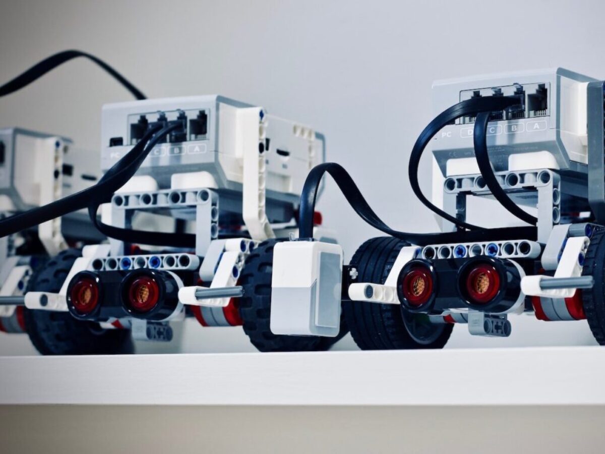 two white and black electronic device with wheels
