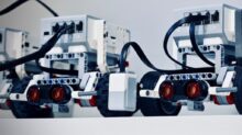 two white and black electronic device with wheels
