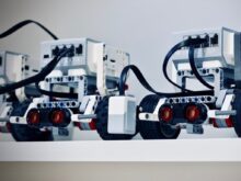 two white and black electronic device with wheels