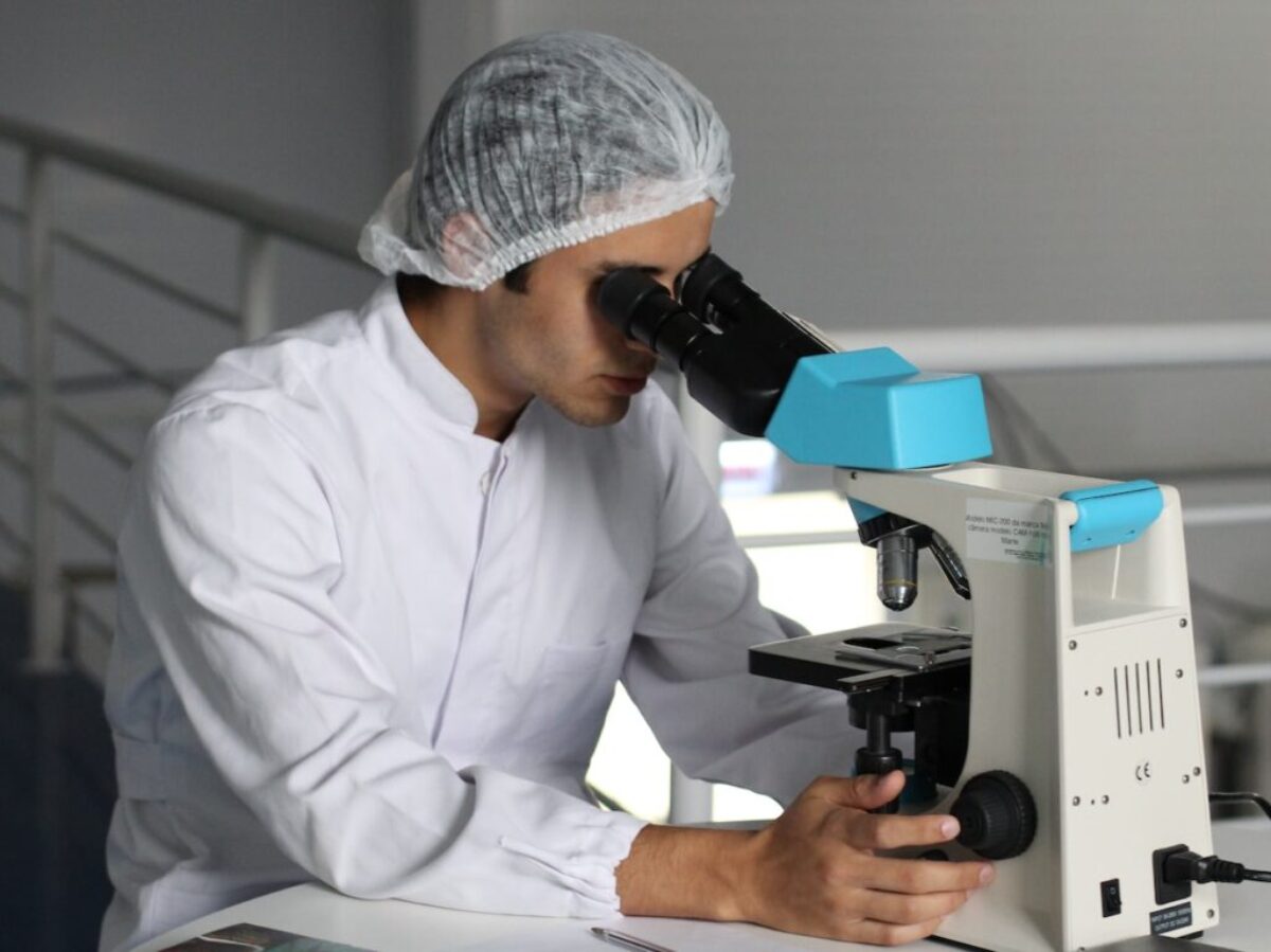 man sight on white microscope
