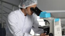 man sight on white microscope