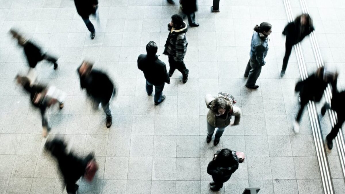 people walking on grey concrete floor during daytime