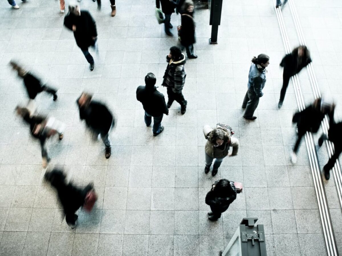 people walking on grey concrete floor during daytime