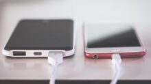 two phones on white table