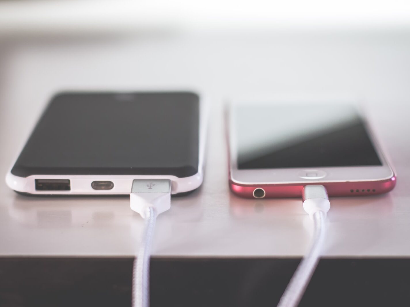 two phones on white table