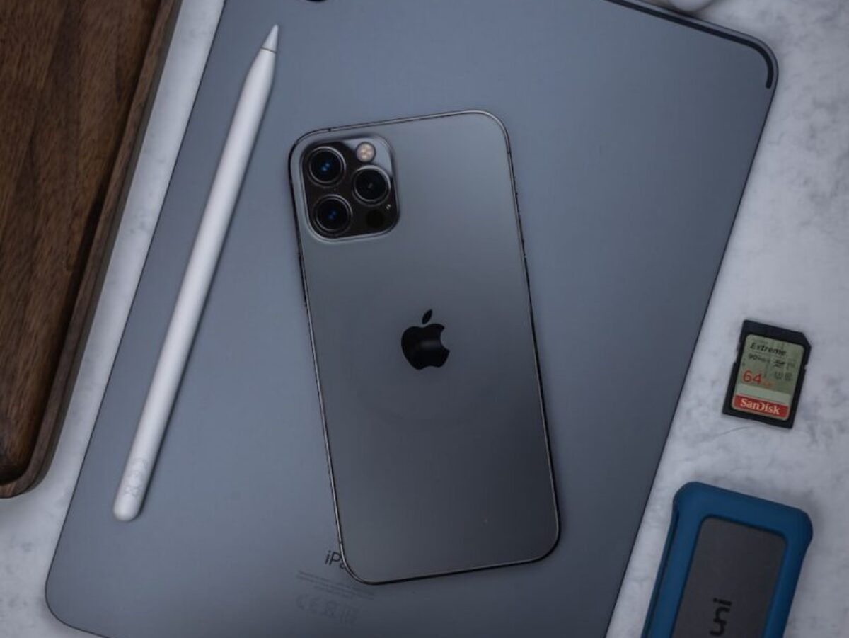silver ipad on brown wooden table