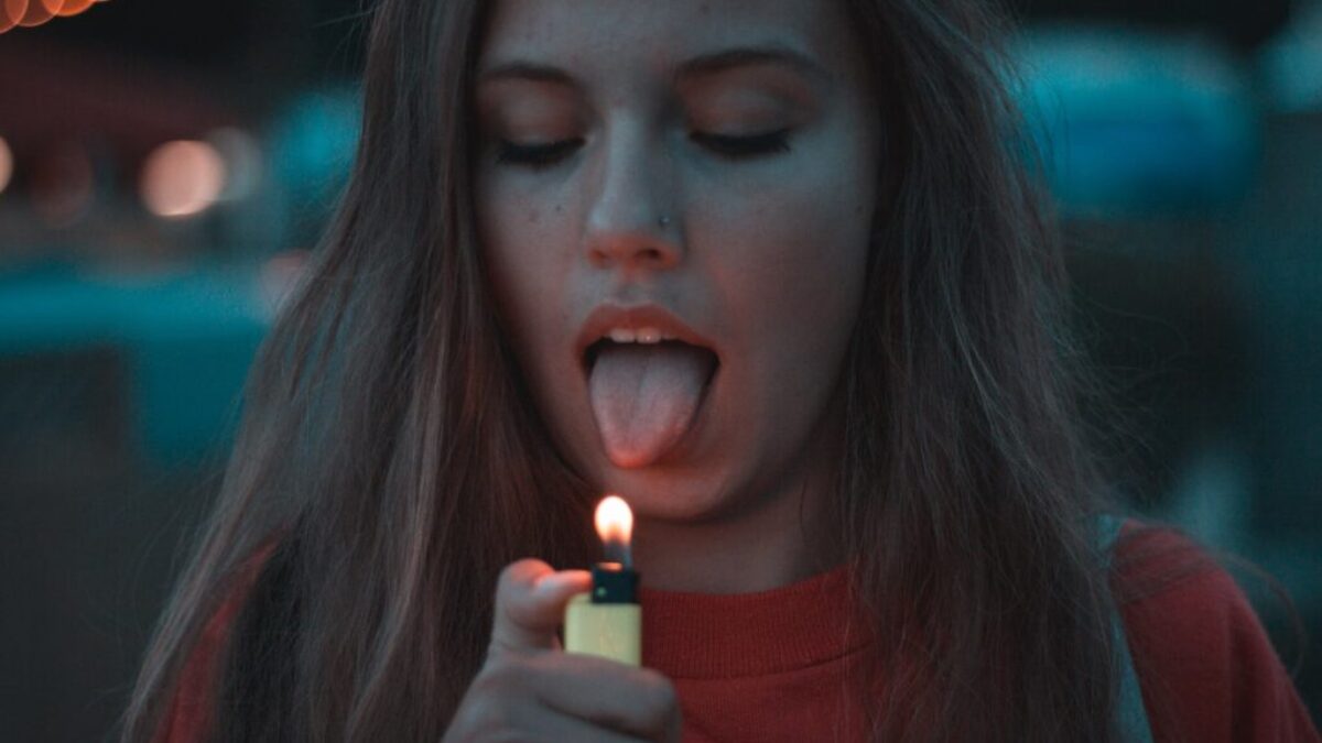 woman lighting up her tongue