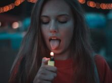 woman lighting up her tongue