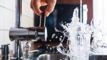 person opening faucet