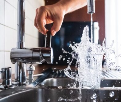 person opening faucet