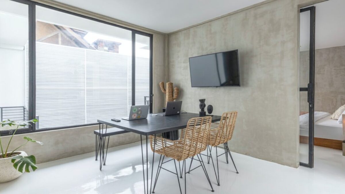 black flat screen tv on brown wooden table
