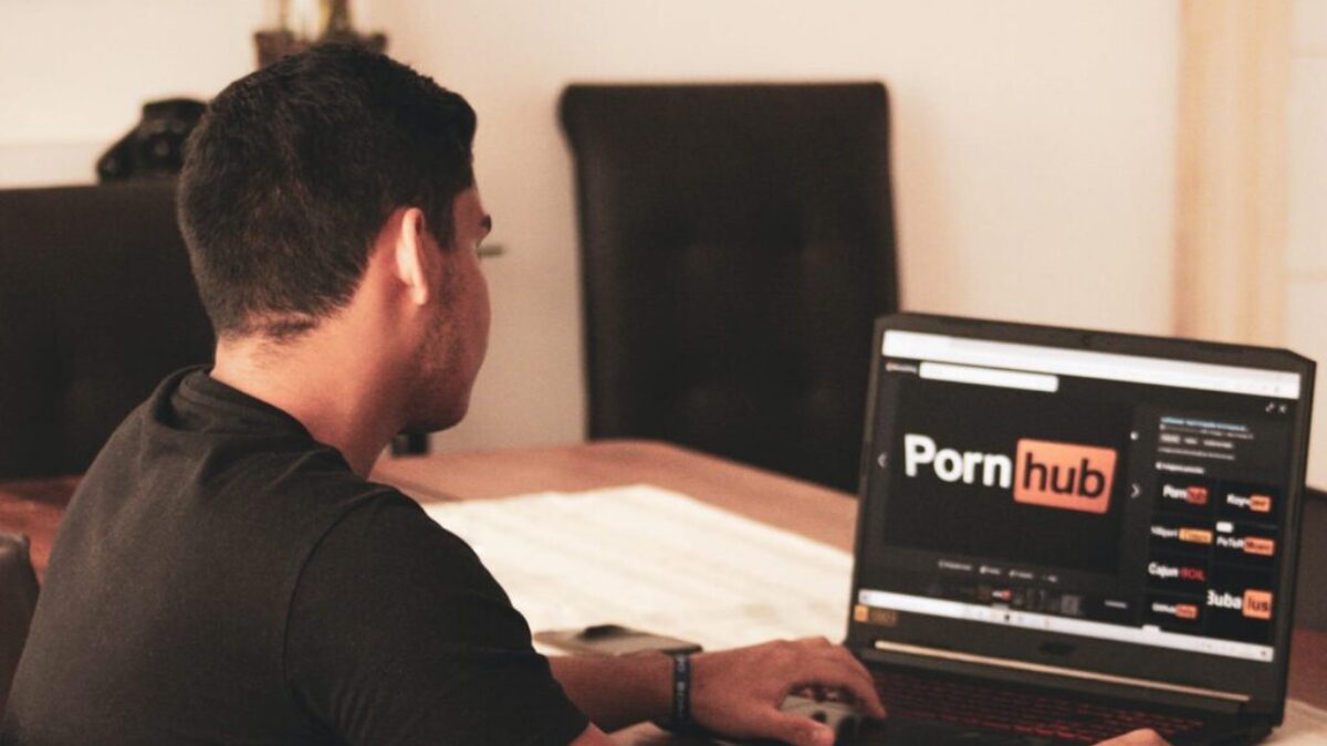 man in black t-shirt using black laptop computer