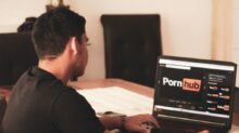 man in black t-shirt using black laptop computer