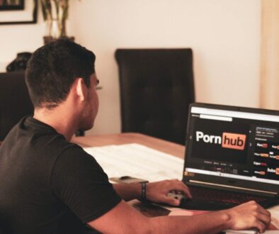 man in black t-shirt using black laptop computer