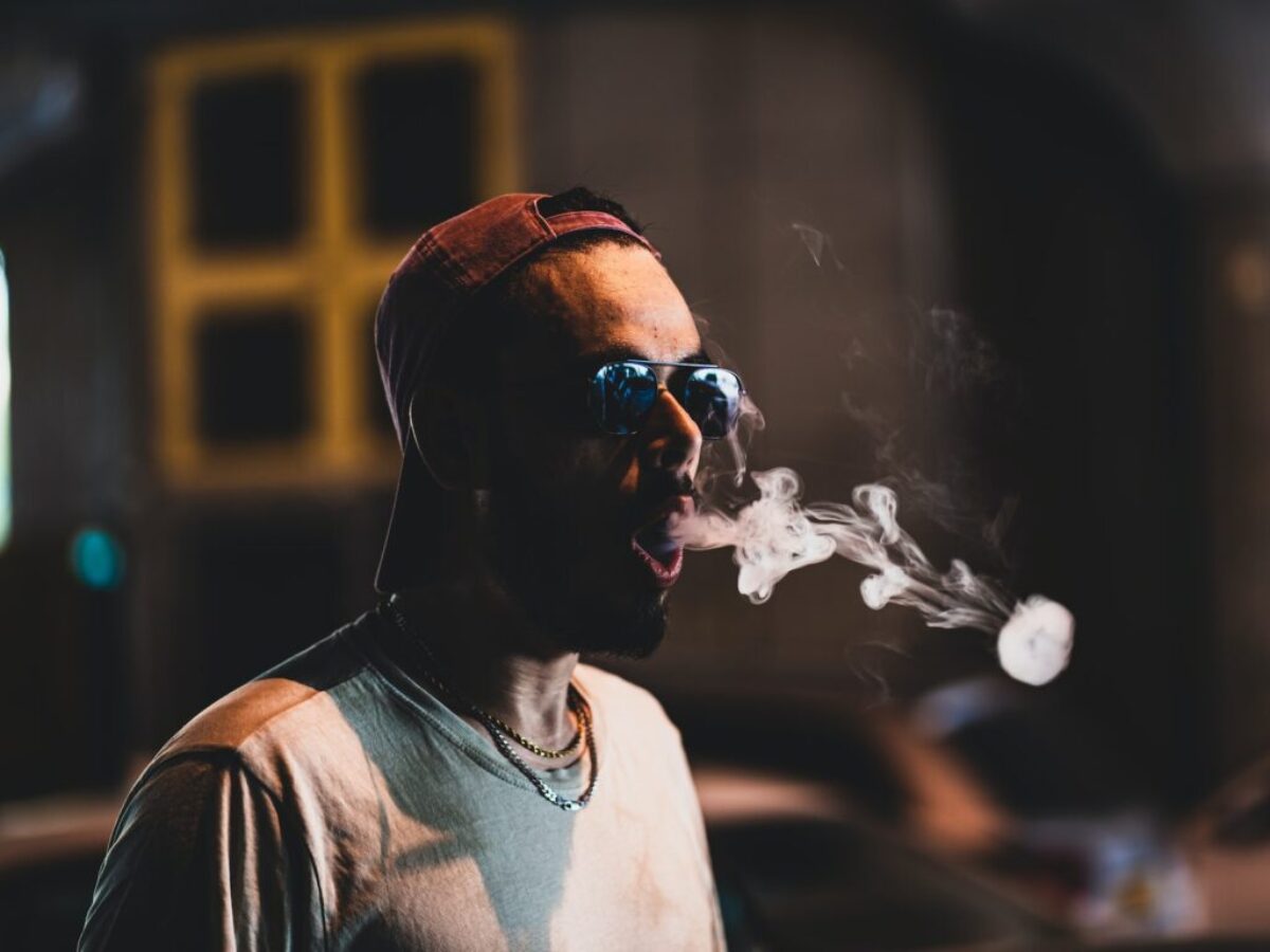 man in white crew neck shirt wearing black sunglasses