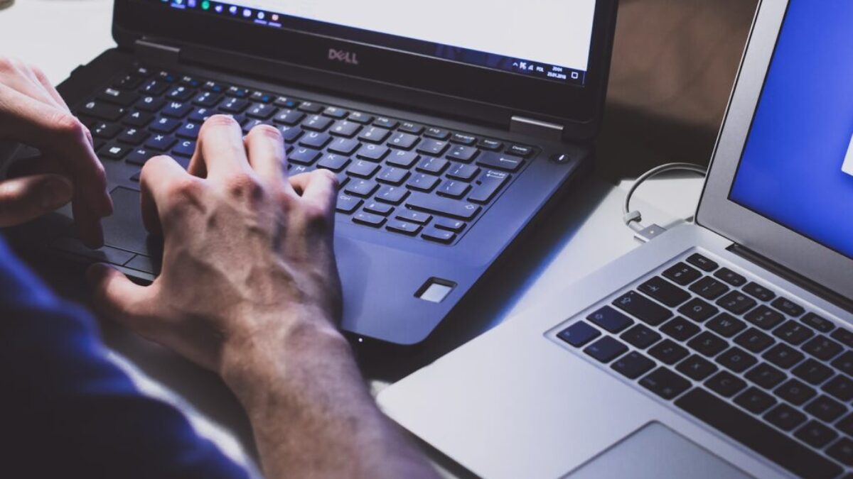 person using black laptop computer