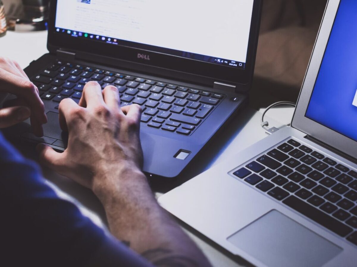 person using black laptop computer