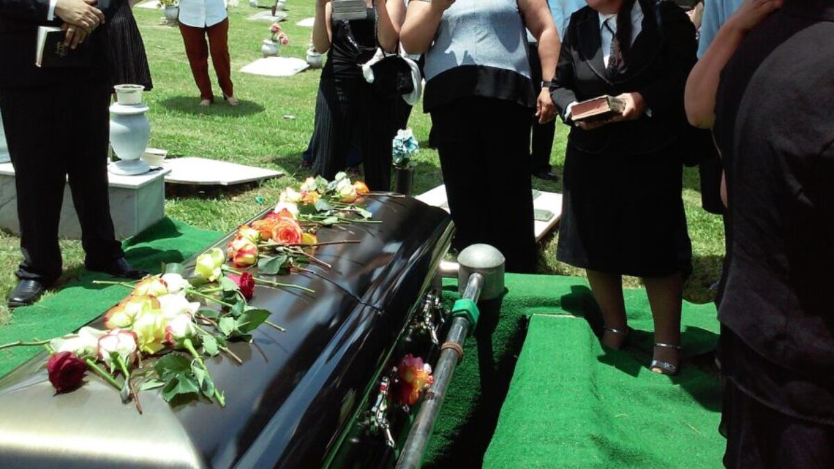 group of people attending burial