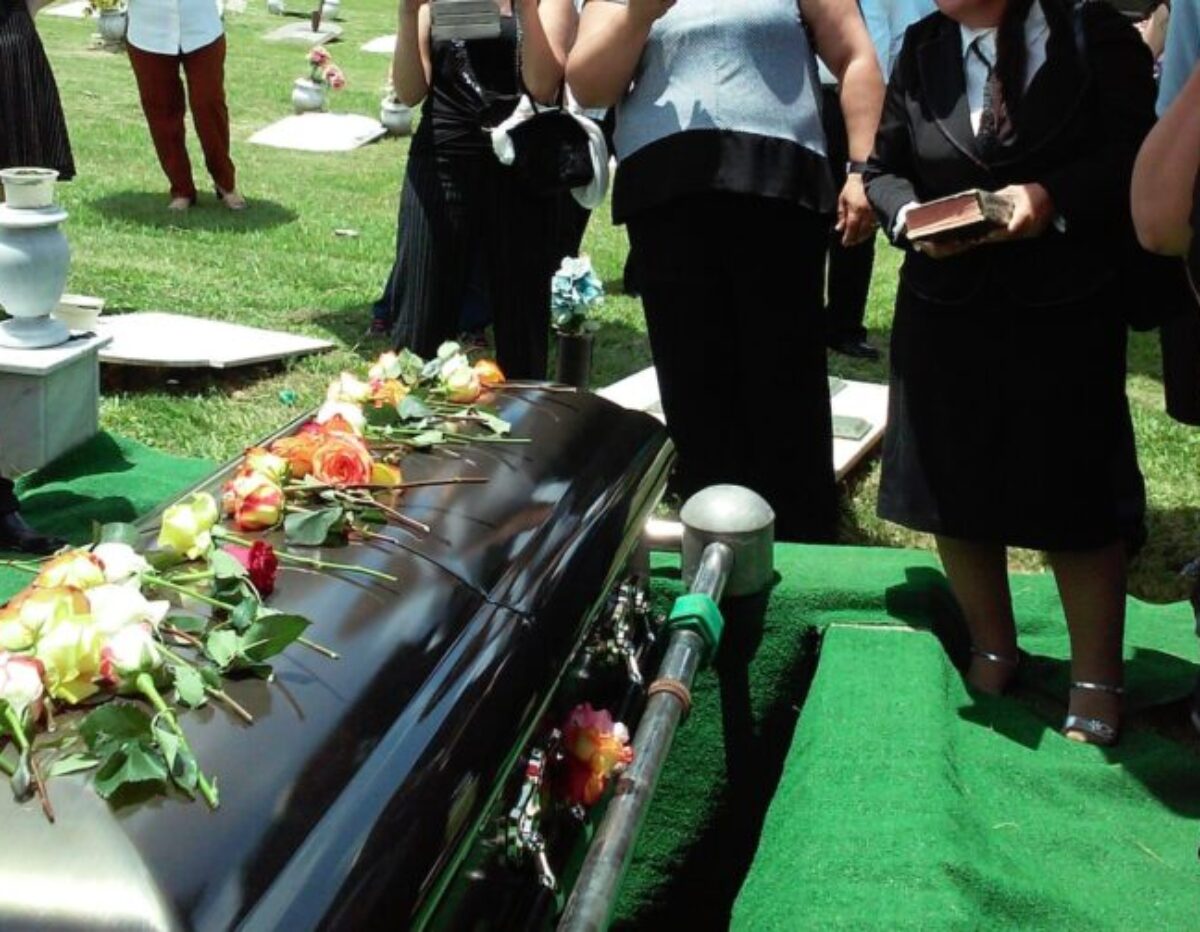 group of people attending burial