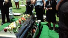 group of people attending burial