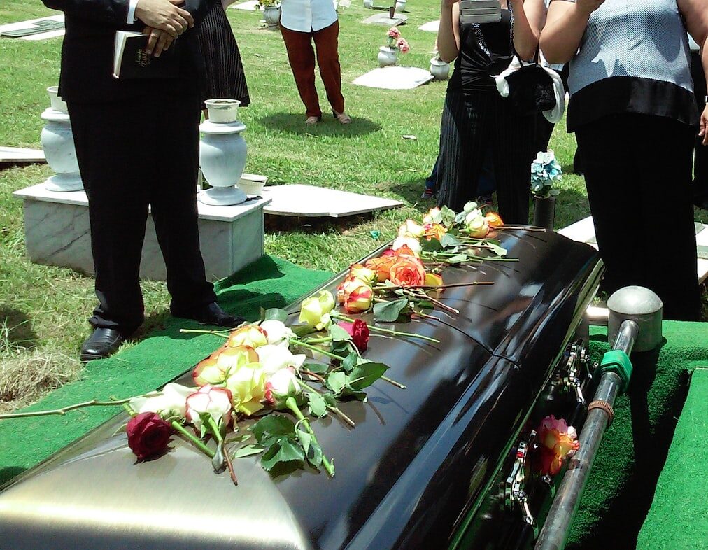 group of people attending burial