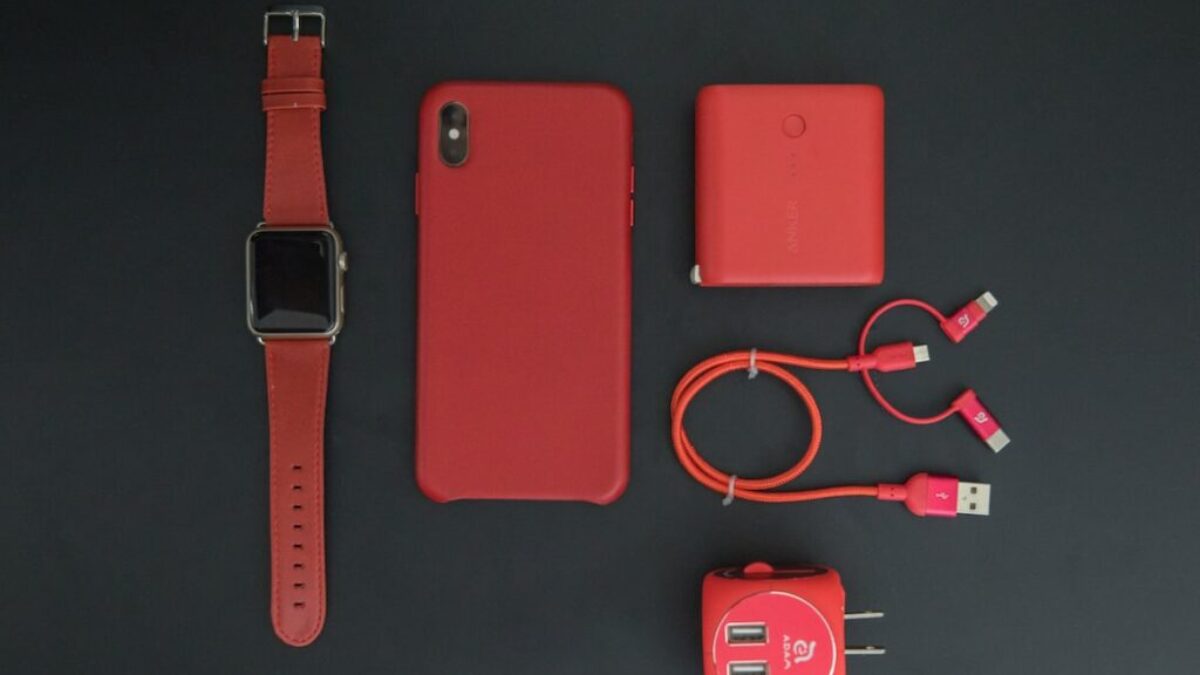 red iPhone and red smartwatch