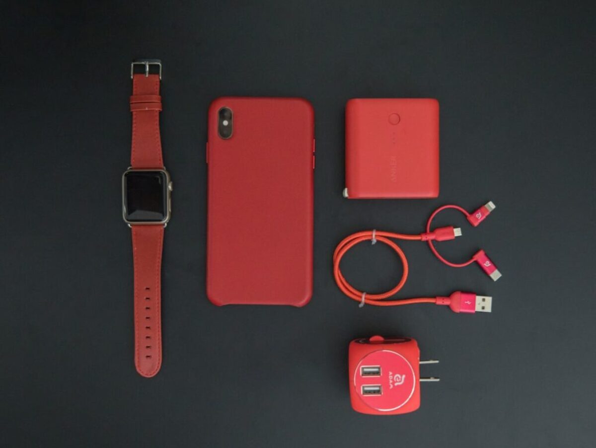 red iPhone and red smartwatch