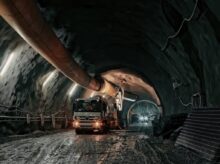 red and black truck in tunnel