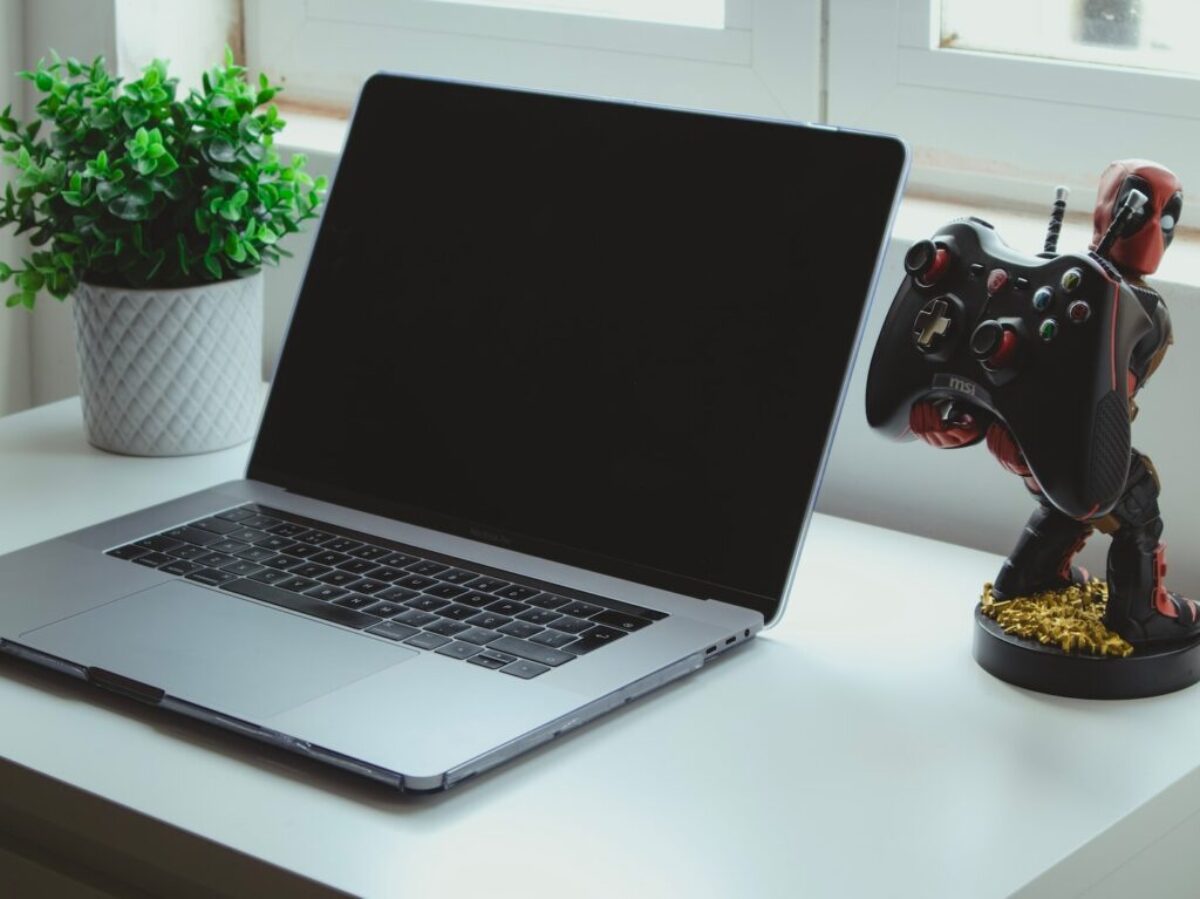 macbook pro on white table