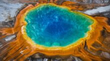 blue and brown water on brown rock